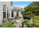 Charming patio space with outdoor seating, grill, and lush greenery, ideal for enjoying outdoor living at 1038 Felman Rd, Durham, NC 27703