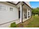 Inviting front porch with rocking chairs and attractive front door at 1038 Felman Rd, Durham, NC 27703