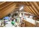 Unfinished attic space is full of stored items at 105 Acorn Ridge Ln, Holly Springs, NC 27540