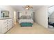 Bright bedroom with a queen bed, large dresser, and neutral carpet at 105 Acorn Ridge Ln, Holly Springs, NC 27540