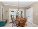Cozy dining area with a round wooden table and access to an outdoor patio at 105 Acorn Ridge Ln, Holly Springs, NC 27540
