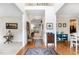 Bright foyer with hardwood floors, natural light, and a view of the home's interior at 105 Acorn Ridge Ln, Holly Springs, NC 27540