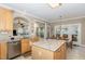 Kitchen with stainless steel appliances, granite countertops, and view to the kitchen nook at 105 Acorn Ridge Ln, Holly Springs, NC 27540