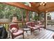 Comfortable screened porch with ceiling fan and wicker furniture at 105 Acorn Ridge Ln, Holly Springs, NC 27540