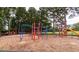 Community playground featuring colorful play structures for  at 105 Acorn Ridge Ln, Holly Springs, NC 27540