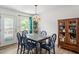 Bright dining area featuring a square table and natural light from the windows and a door at 105 Otter Dr, Cary, NC 27513