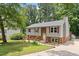 Charming split-level home featuring gray siding, brick accents, and a well-maintained front yard at 105 Otter Dr, Cary, NC 27513