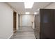 Finished hallway with modern flooring, neutral walls, and access to other rooms at 105 Otter Dr, Cary, NC 27513