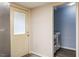 Convenient laundry area with modern washing machine, dryer and door to the outside at 105 Otter Dr, Cary, NC 27513
