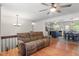 Comfortable living room with hardwood floors, a ceiling fan, and an open view to the kitchen at 105 Otter Dr, Cary, NC 27513