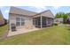 Backyard view showcasing the patio and screened porch, perfect for outdoor living and entertaining at 1120 Hooper Pl, Durham, NC 27703