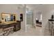 Bright bathroom showing vanity, large glass shower, and doorway to the bedroom at 1120 Hooper Pl, Durham, NC 27703