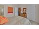 Comfortable bedroom with a cozy quilt, decorative art, and a view to an adjoining bathroom at 1120 Hooper Pl, Durham, NC 27703