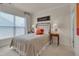 Cozy bedroom featuring a quaint bed, soft carpeting, and a bright window for natural light at 1120 Hooper Pl, Durham, NC 27703
