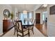 Elegant dining room featuring a large table, chandelier, and views of the front entry at 1120 Hooper Pl, Durham, NC 27703