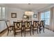 Elegant dining room with large table, chandelier, decorative mirror, and detailed trim at 1120 Hooper Pl, Durham, NC 27703