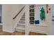 Convenient entryway with a staircase and built-in shelving, providing ample storage and organization space at 1120 Hooper Pl, Durham, NC 27703