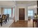 Inviting foyer with hardwood floors and traditional wood door, adjacent to the dining and living spaces at 1120 Hooper Pl, Durham, NC 27703