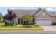 Charming home exterior with a two-car garage, beautiful landscaping, and a welcoming front entrance at 1120 Hooper Pl, Durham, NC 27703