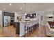 Gourmet kitchen with granite island, stainless steel appliances, and breakfast bar seating at 1120 Hooper Pl, Durham, NC 27703