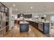 Gourmet kitchen with stainless steel appliances, spacious granite countertops, and a large kitchen island at 1120 Hooper Pl, Durham, NC 27703
