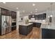 Modern kitchen with stainless steel appliances, granite countertops, and a central island at 1120 Hooper Pl, Durham, NC 27703