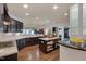 Spacious kitchen featuring granite countertops, stainless appliances, and island with seating at 1120 Hooper Pl, Durham, NC 27703