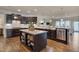 Gourmet kitchen with stainless steel appliances, spacious granite countertops, and a large kitchen island at 1120 Hooper Pl, Durham, NC 27703