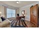 Cozy office space with hardwood floors, a large desk, and natural light, perfect for working from home at 1120 Hooper Pl, Durham, NC 27703