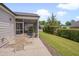 Outdoor patio with table and chairs, ideal for al fresco dining and enjoying the serene backyard at 1120 Hooper Pl, Durham, NC 27703