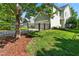 Fenced backyard with healthy green grass and a view of neighboring houses at 1201 Somers Dr, Morrisville, NC 27560