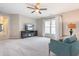 Comfortable bedroom featuring a ceiling fan, chair, and television at 1201 Somers Dr, Morrisville, NC 27560