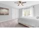 Bedroom with ceiling fan, neutral walls, and large window for ample natural light at 1201 Somers Dr, Morrisville, NC 27560