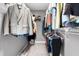 Walk-in closet with abundant storage space, shelving, and clothing racks at 1201 Somers Dr, Morrisville, NC 27560