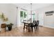 Charming dining room with modern chandelier and large window at 1201 Somers Dr, Morrisville, NC 27560