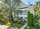 Charming two-story home with covered porch, lush landscaping, and a welcoming entrance at 1201 Somers Dr, Morrisville, NC 27560