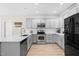 Stylish kitchen with stainless steel appliances, gray cabinets, and ample counter space at 1201 Somers Dr, Morrisville, NC 27560