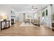 Bright living room featuring large windows, ceiling fan, and comfortable seating at 1201 Somers Dr, Morrisville, NC 27560