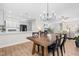 Open-concept living space with modern dining area and stylish kitchen at 1201 Somers Dr, Morrisville, NC 27560