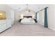 Expansive primary bedroom with carpet floor, high ceiling, and large windows at 1201 Somers Dr, Morrisville, NC 27560