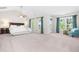 Large bedroom features carpet floor, high ceiling, a ceiling fan and lots of natural light at 1201 Somers Dr, Morrisville, NC 27560