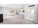 Spacious primary bedroom with large windows, ensuite access and a white dresser at 1201 Somers Dr, Morrisville, NC 27560