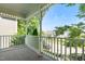 View from the porch with decorative columns and railings overlooking the street at 1201 Somers Dr, Morrisville, NC 27560