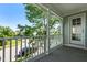 View from the front porch with decorative white pillars, railing, and door; great curb appeal at 1201 Somers Dr, Morrisville, NC 27560