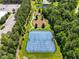Aerial view of a community tennis court surrounded by lush greenery and trees at 1201 Somers Dr, Morrisville, NC 27560
