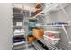 Organized walk-in closet with wire shelving, stacked towels, and storage containers at 1201 Somers Dr, Morrisville, NC 27560