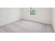 Neutral bedroom with carpeting, white walls, and natural light from window at 1212 Solace Way, Rolesville, NC 27571