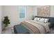 Stylishly furnished bedroom featuring an accent wall with designer bedding and a bright window at 1212 Solace Way, Rolesville, NC 27571