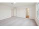 Spacious bedroom with neutral walls, plush carpeting, and access to an ensuite bathroom at 1212 Solace Way, Rolesville, NC 27571