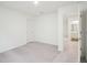 Bright bedroom featuring neutral walls, plush carpet, and a convenient ensuite bathroom at 1212 Solace Way, Rolesville, NC 27571